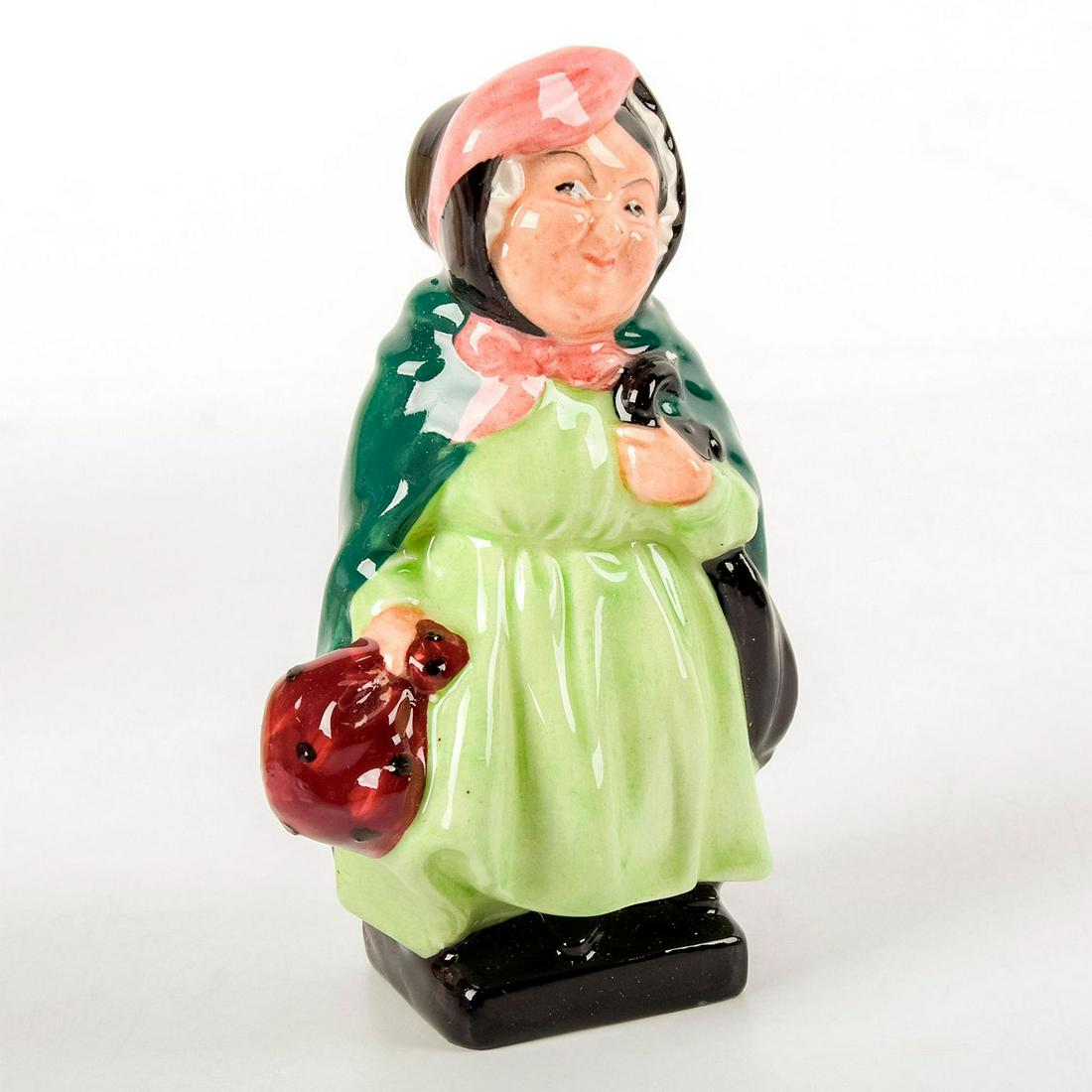 Sairey Gamp M46 - Royal Doulton Dickens Figurine: Comes in "The Works of Charles Dickens" book shaped box. Lime green, green and pink coloration. Character from Dicken's "Martin Chuzzlewit". Royal Doulton backstamp. Good condition. #CharlesDickens Ar