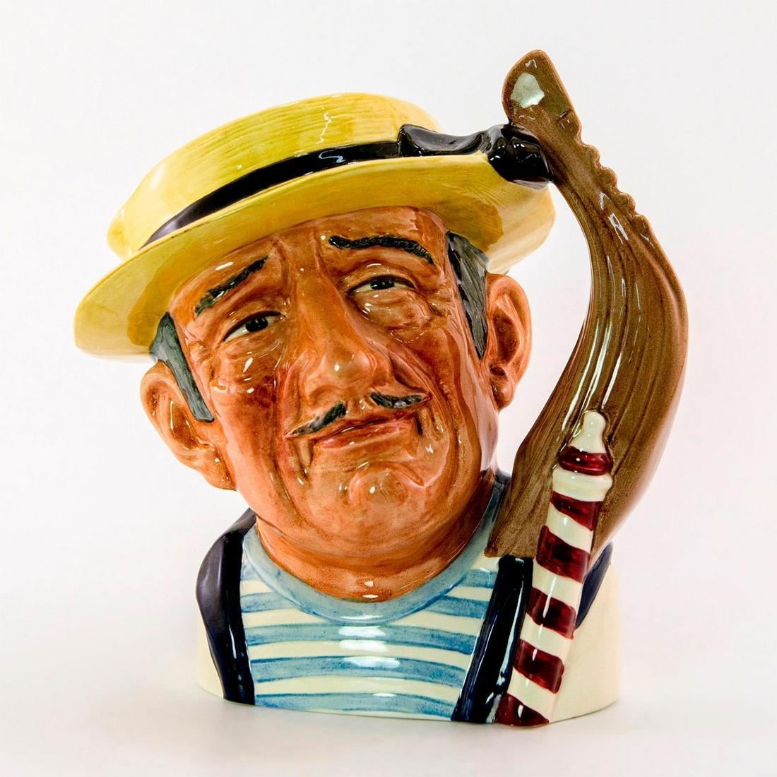 Gondolier D6589 - Large - Royal Doulton Character Jug: Yellow hat, blue and white t-shirt, maroon and white pole. Royal Doulton backstamp. Small chip on lip. Artist: David B. Biggs Issued: 1964 - 1969 Dimensions: 8"H Manufacturer: Royal Doulton Countr
