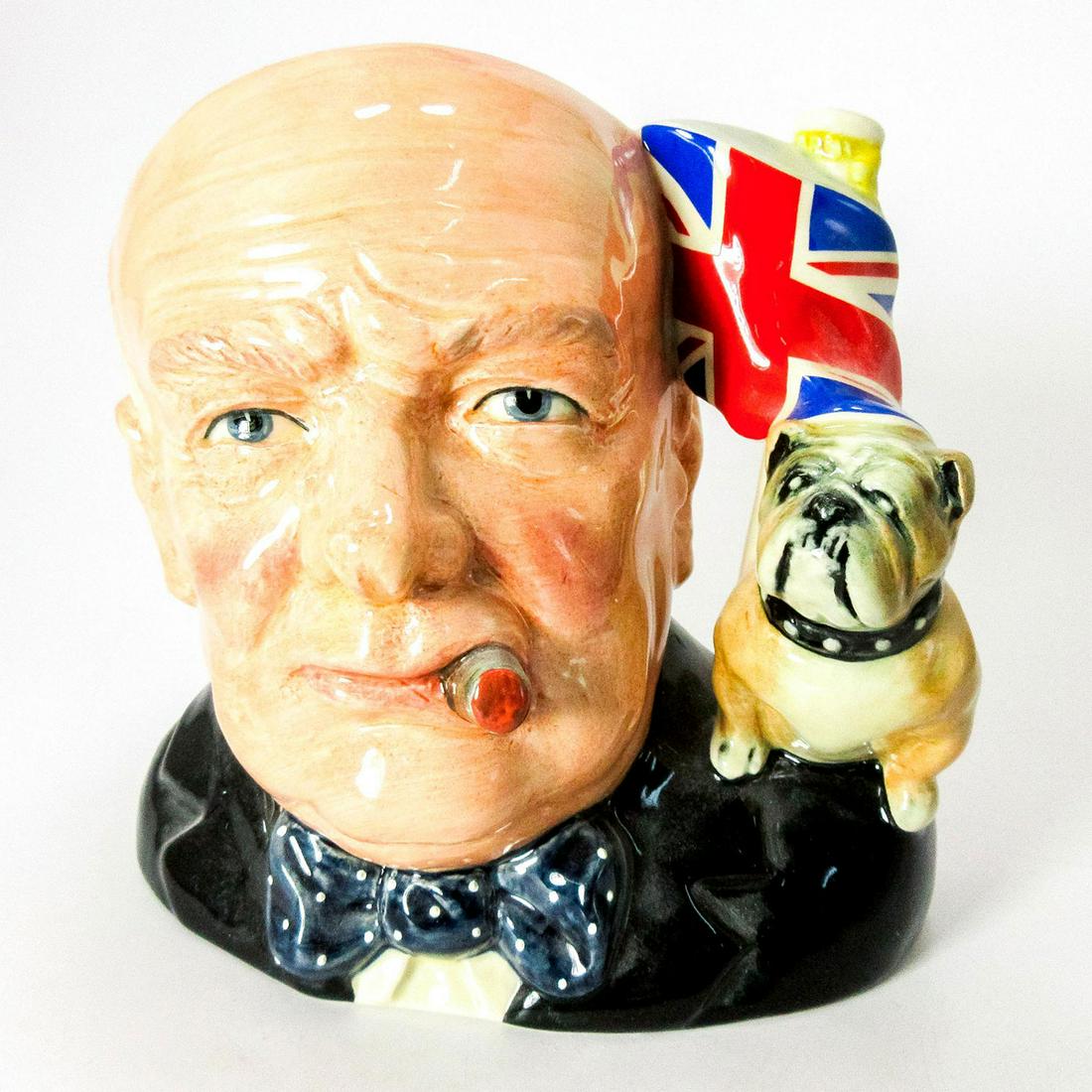 Winston Churchill D6907 (Union Jack and Bulldog Handle) - Large - Royal Doulton Character Jug: Style One. Black, brown and white coloration. This Winston Churchill jug was the Character Jug of the Year 1992. Series: Character Jug of the Year. Royal Doulton backstamp. Artist: Stanley J. Taylor I