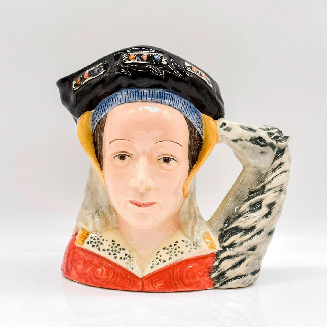Anne of Cleves (Ears Up) D6653 - Large - Royal Doulton Character Jug: Style One, Variation One. Horse's ears pointing up. Black and red coloration. In a political arrangement by Thomas Cromwell, Anne of Cleves (1515 - 1557) was chosen to marry Henry VIII. Anne became hi