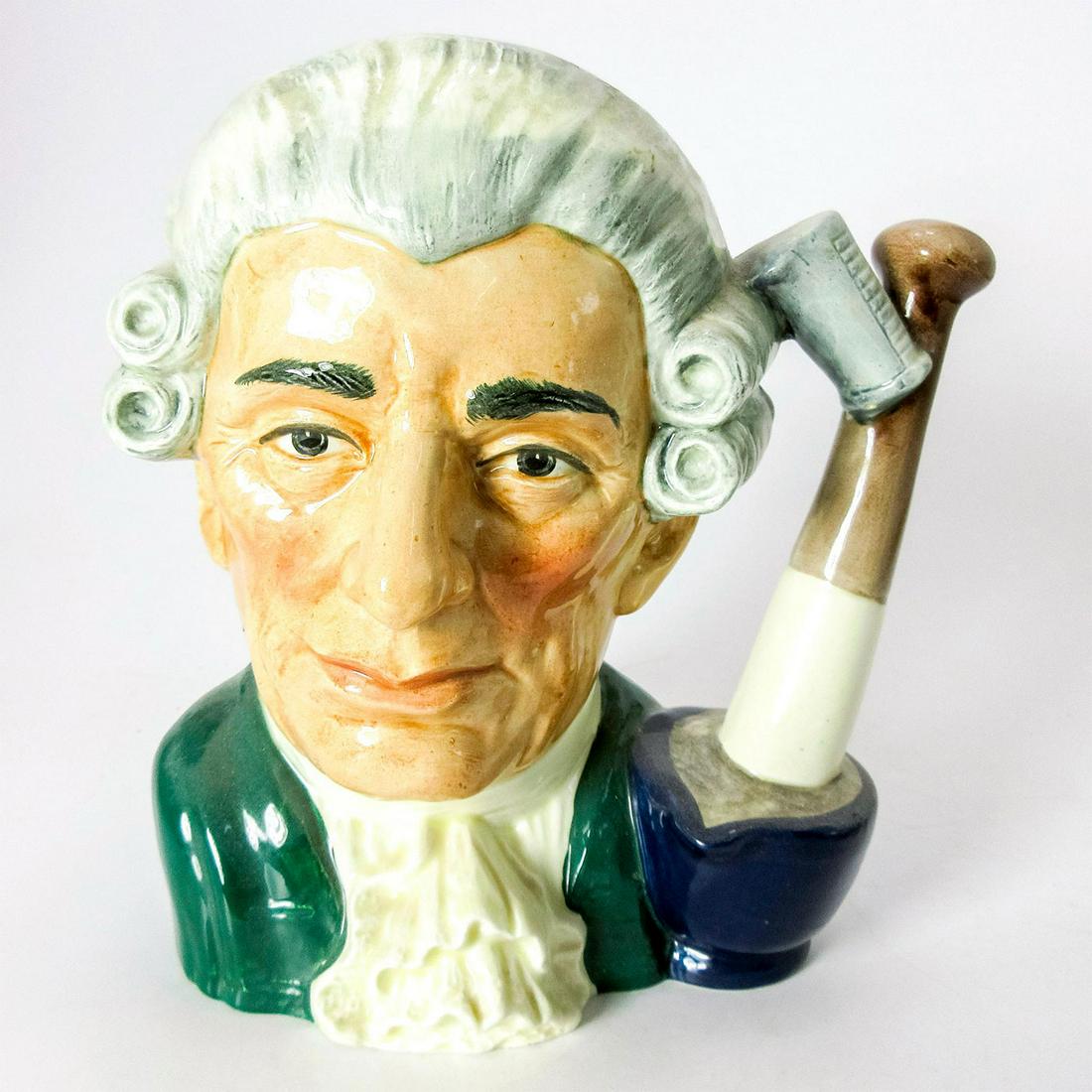 Apothecary D6567 - Large - Royal Doulton Character Jug: Green coat with white cravat, white wig. Along with the other characters in the Williamsburg Series, the apothecary was central to colonial life in 18th century America. Royal Doulton backstamp. Artis