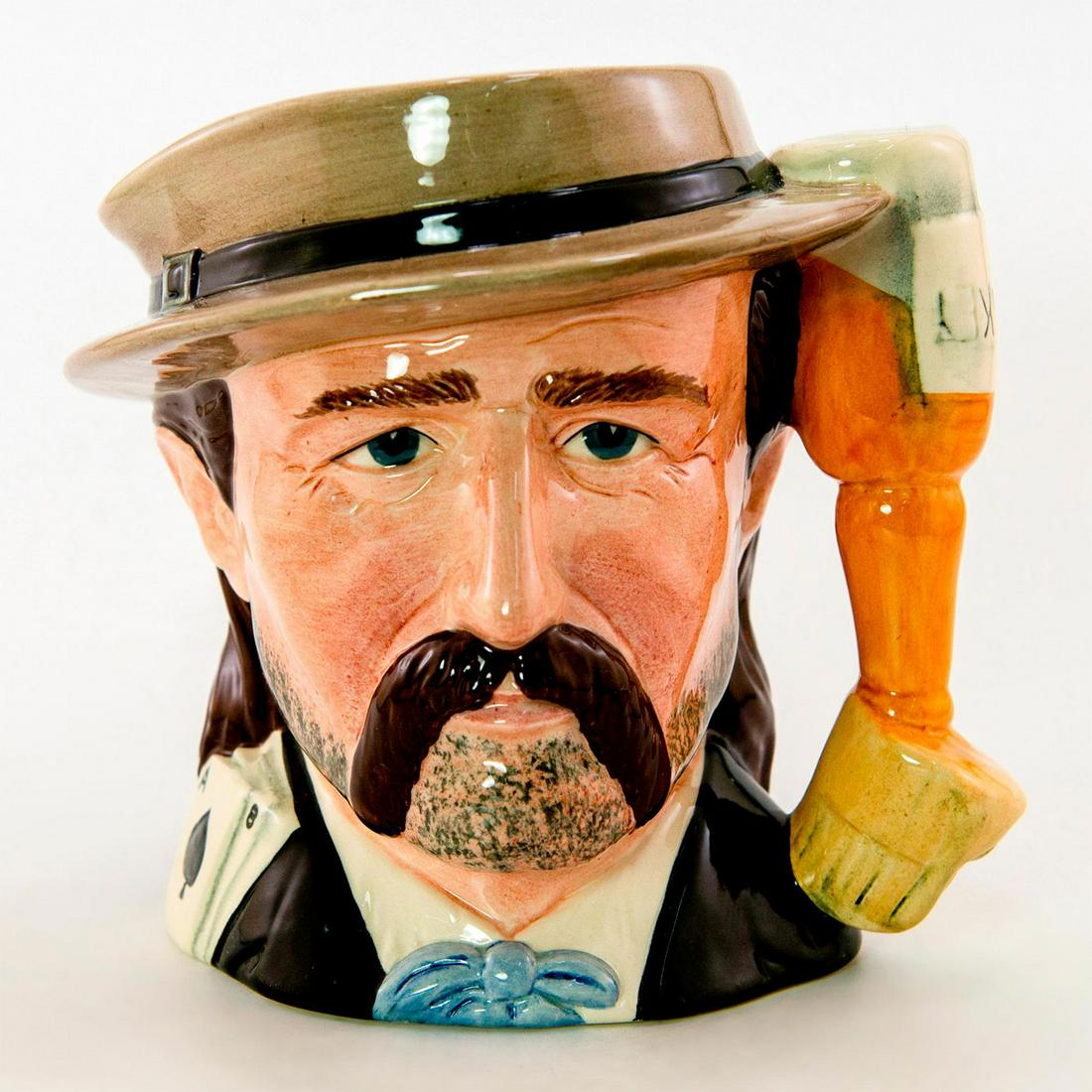 Wild Bill Hickock D6736 - Odd Size - Royal Doulton Character Jug: Black, brown and white coloration. The Wild West Collection. Royal Doulton backstamp. Artist: Michael Abberley Issued: 1985 - 1989 Dimensions: 5.5"H Manufacturer: Royal Doulton Country of Origin:<