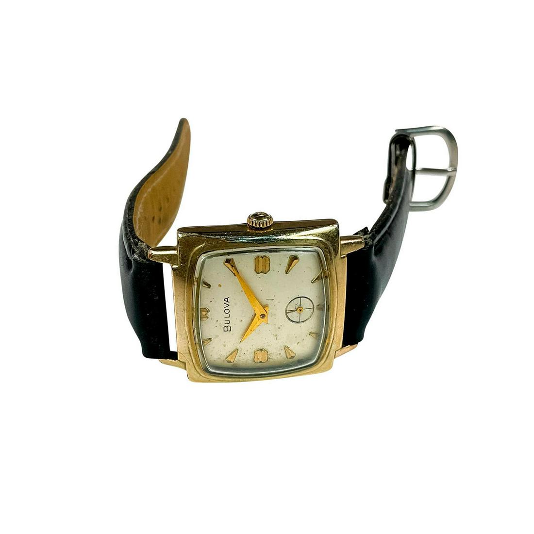 Bulova 10K Rolled Gold Plate Watch: Unisex Watch In Classic Design with a Square Face. Model M6. Serial number I986430. Aftermarket band. Measures 9" full length. Manufacturer: Bulova Country of Origin: Switzerland