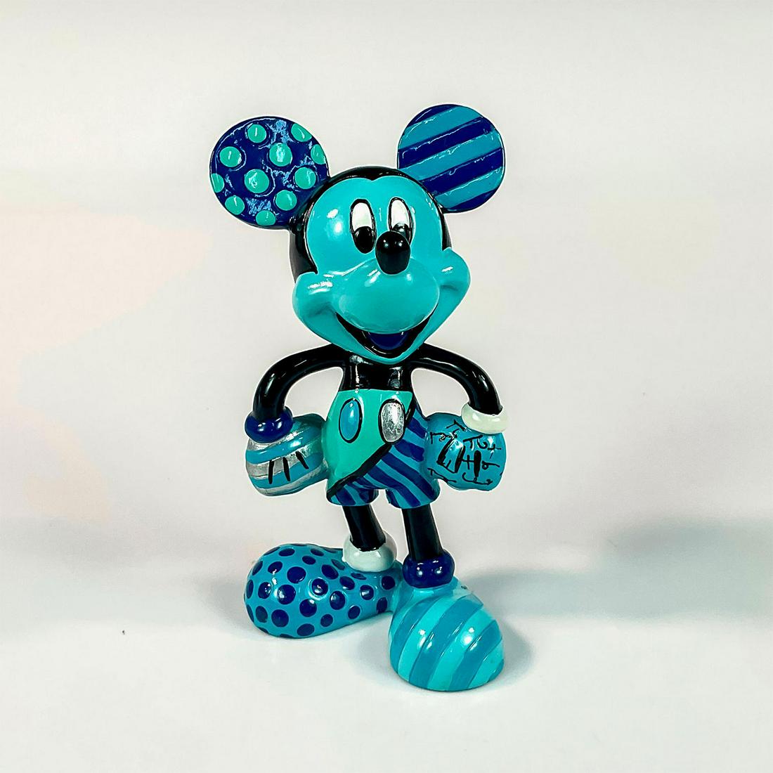 Disney Romero Britto Figurine, Mickey Mouse: Part of The Blue Period. Resin character all in blue with stripes, polka dots and doodles. Disney Britto backstamp. Romero Britto signature on foot. Artist: Romero Britto Issued: 2010 Dimensions: 2.25