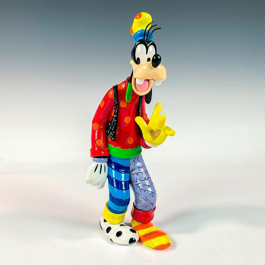 Disney Romero Britto Figurine, Goofy: Colorful outfit on resin figurine with shoes designed in stripes and polka dots. Gold colored heart in palm of hand. Disney Britto backstamp. Romero Britto signature on foot. Artist: Romero Britto Iss