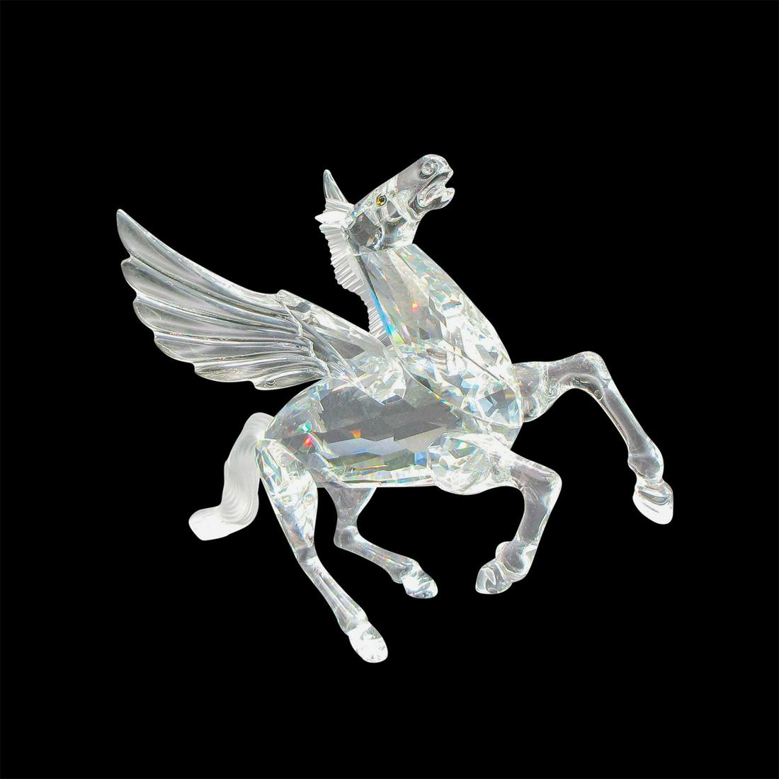 Swarovski SCS Crystal Figurine, Pegasus: Part of the Fabulous Creatures collection. Clear body, face and wings with frosted mane and tail. Black inset eyes. Swarovski backstamp. 7400 098 000. This item has its original box: 9.5"L x 9.5"W x 5