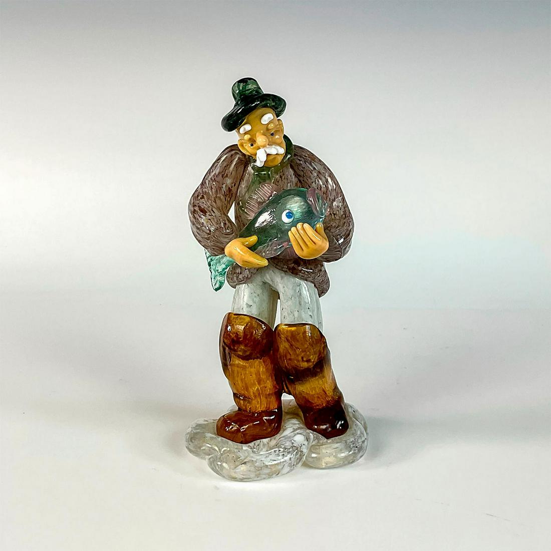 Vintage Czech Glass Fisherman Figurine: Colorful and detailed glass figurine modeled as mustachioed fisherman holding a terrified fish. Expressive facial details. Attributed to Czech glass brand Zelezny Brod Sklo and designer Jaroslav Brych