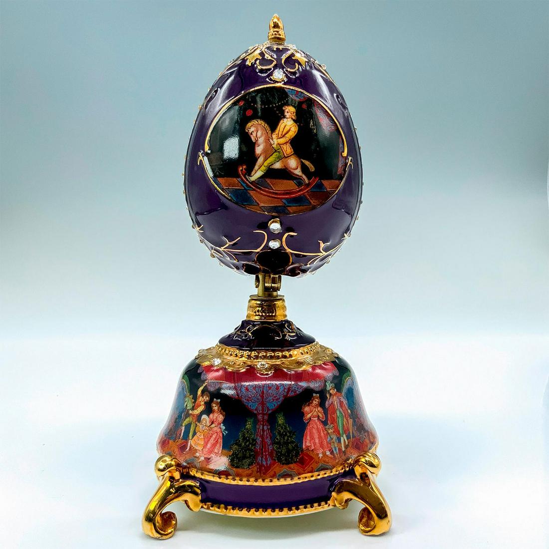 The Nutcracker Ballet Collection Music Box, The Mouse King: A purple-colored music box depicting moments of the Nutcracker Ballet with the center piece able to open to reveal a figurine of "The Mouse King". Plays "Waltz of the Flowers" when wound. Artist: Ardl