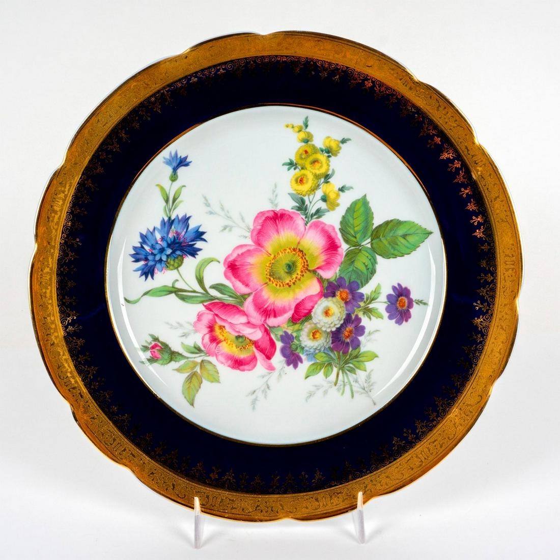 Vintage Limoges France Porcelain Cabinet Plate: Hand painted flowers in the center with a cobalt blue and gold rim. Marked Limoges on the bottom. Dimensions: 1"H x 10"Dia Country of Origin: France