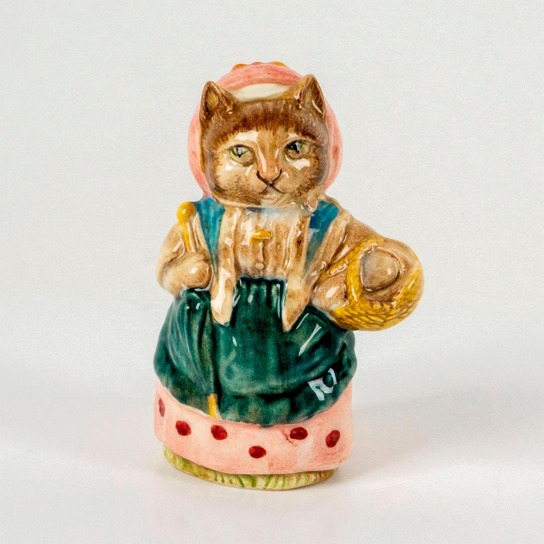 Beswick Beatrix Potter's Figurine, Cousin Ribby: Depicts a tabby cat wearing a pink hat and dress with a green apron while holding a basket. Beswick backstamp. Dimensions: 2.25"L x 1.75"W x 3.75"H Manufacturer: Beatrix Potter Country of Origin: Engl