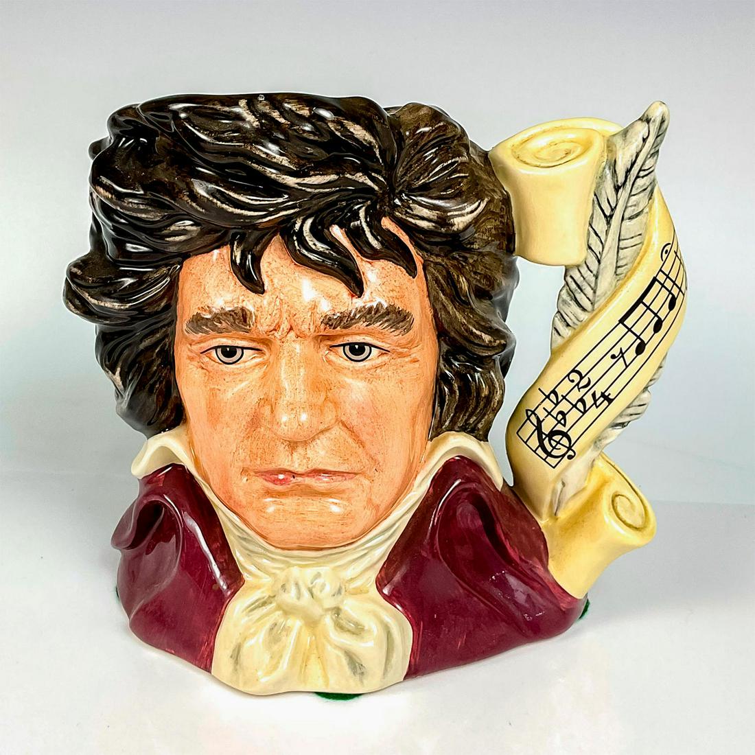 Beethoven D7021 - Large - Royal Doulton Character Jug: Brown, white and maroon coloration. Series: Great Composers. Royal Doulton backstamp. Artist: Stanley J. Taylor Issued: 1996 - 2001 Dimensions: 7"H Manufacturer: Royal Doulton Country of Origin:</
