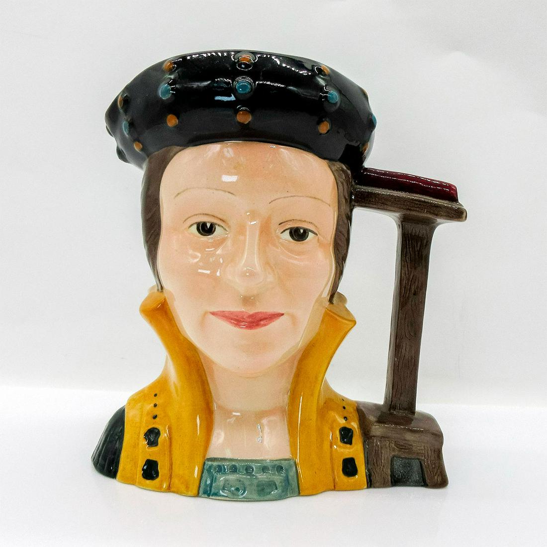 Catherine Parr D6664 - Large - Royal Doulton Character Jug: Style One. Black, brown, and gold coloration. Signed by Michael Doulton. Catherine Parr (1512 - 1548) became Henry VIII's last wife on July 12, 1543, after being twice widowed. She came to wield c
