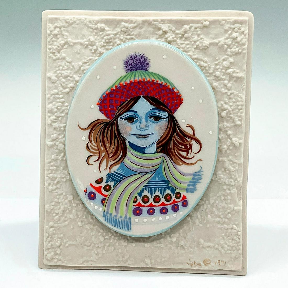 Cybis Limnettes Wonderful Seasons Plaque, Winter: An oval porcelain plaque depicting a portrait of Winter. Placed on a texture triangle base. Cybis mark on the front. Artist: George Ivers Issued: c. 1971 Dimensions: 4.5"L x 2.25"W x 5"H Manufacturer:
