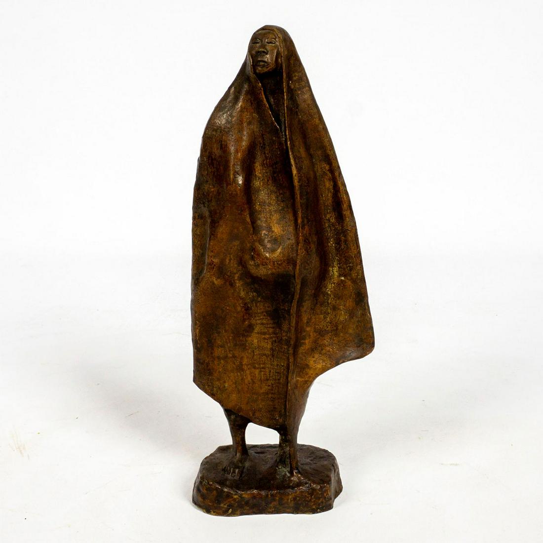 After Francisco Zuniga (Costa Rican/Mexican, 1912-1988): This bronze sculpture represents a woman standing with her chin up and eyes closed as she holds a wrapped rebozo around her body and above her head. Renowned Latin American artist Francisco Zuniga scu