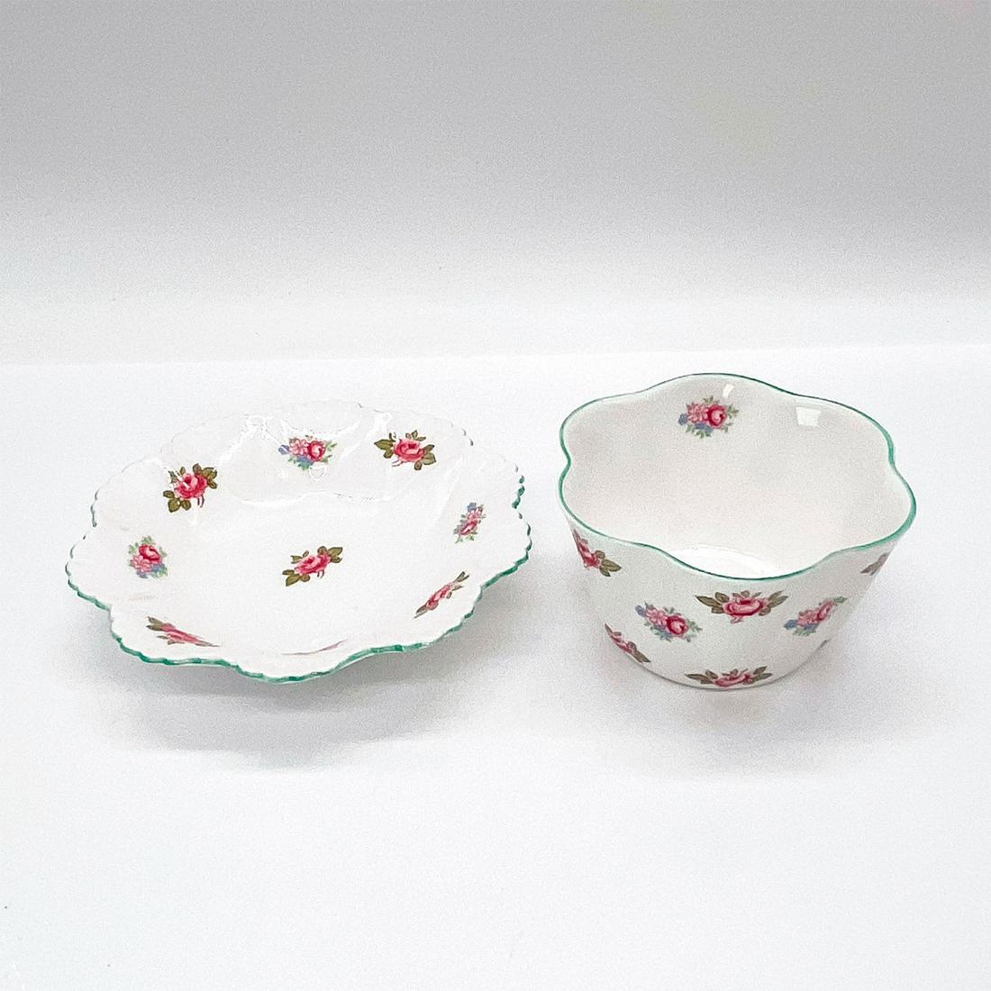 Vintage Shelly Bone China Sugar and Berry Bowl Rosebud: Set of two, both Rosebud 13426 pattern. Shelley England backstamp. Berry bowl dimensions 4.75 in. L x 4.75 in. W x 1 in. H, sugar cup dimensions 3.5 in. L x 3.5 in. W x 2 in. H. Dimensions: 4.75"L x 4