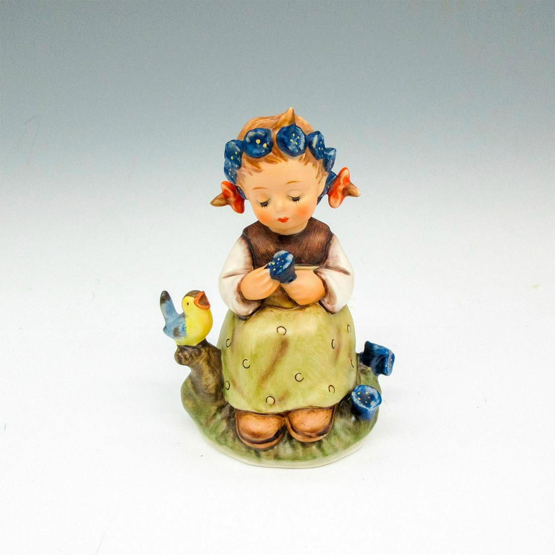 Goebel Hummel Porcelain Figurine, The Botanist 351: Hand crafted little girl sitting with bird and flower in her hand and hair. Goebel backstamp. Hummel imprint on base. Issued: 1979-1990 Dimensions: 2.75"L x 2"W x 3.75"H Manufacturer: Goebel Hummel Co