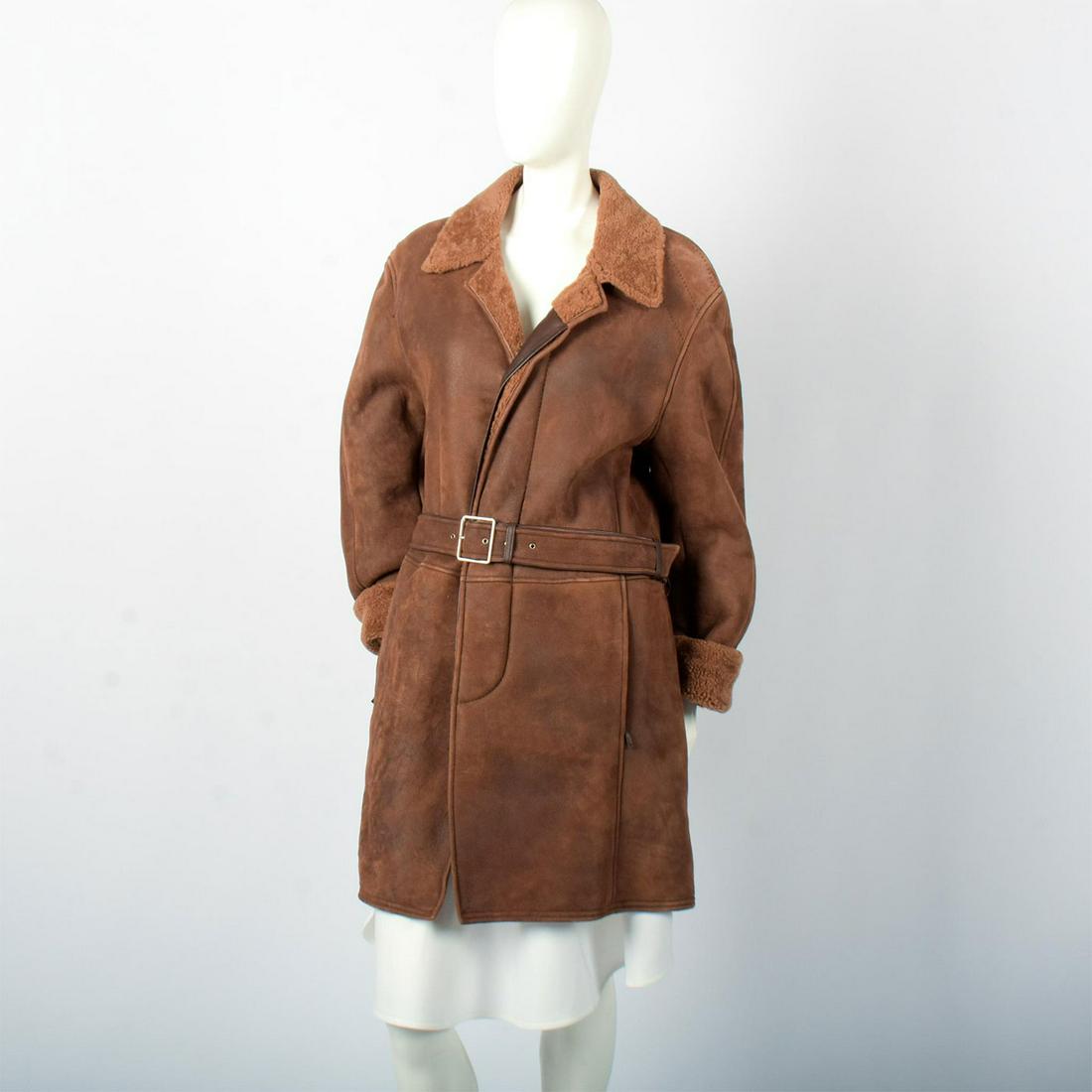 Men's Brioni for Neiman Marcus Size Medium Leather Shearling Coat: Size 50. Handcrafted genuine leather brown coat, with a leather belt. By Brioni for Neiman Marcus stitched patch inside. Hem length: 38"L. Shoulder width: 19"W. Sleeve length: 24"L. #Coat #Brioni Arti