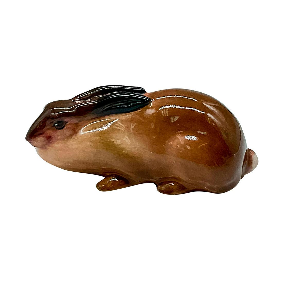 Royal Doulton Animal Figurine, Crouching Hare HN142: Brown with black on the tips of the laid back ears. Royal Doulton backstamp. Issued: 1917-1946 Dimensions: 4.25"L x 2"W x 1.75"H Manufacturer: Royal Doulton Country of Origin: England