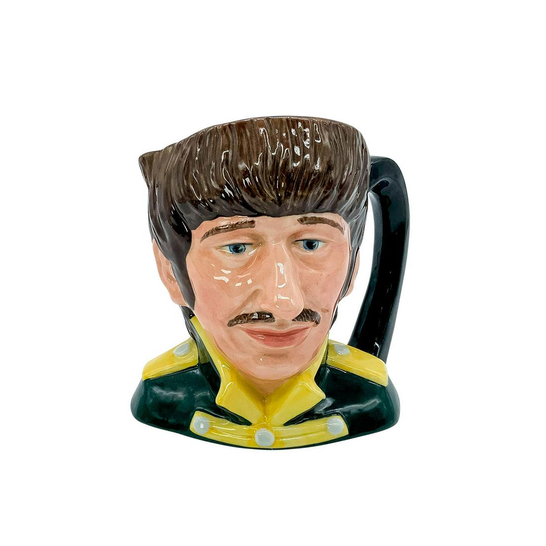 Ringo Starr D6726 - Odd Size - Royal Doulton Character Jug: Black tunic; yellow collar and epaulettes. Richard Starkey (b.1940) was the drummer for the Beatles until they disbanded in 1970.Series: The Beatles. Royal Doulton backstamp. Signed by Michael Doulton