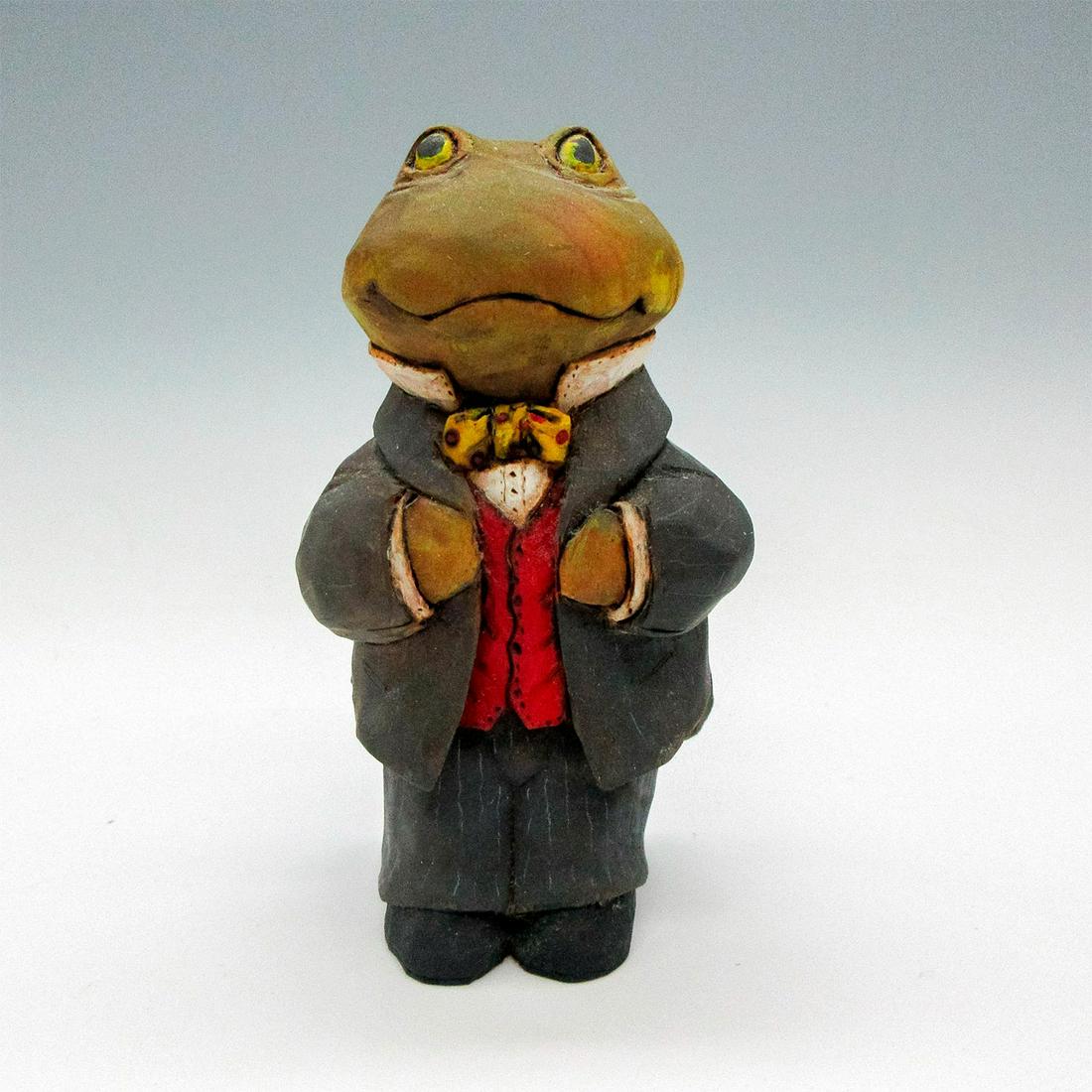 Laury Nichols Wood Carved Professional Frog Figurine: Smiling business frog in suit and bow polka dot bow tie. L. Nichols backstamp. Issued: c.2000 Dimensions: 2.5"L x 2.25"W x 4.5"H Manufacturer: Laury Nichols Country of Origin: United States