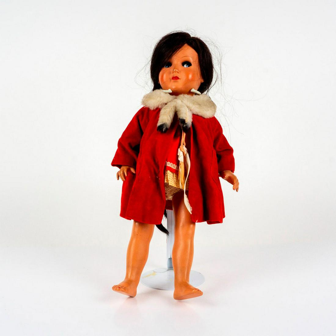 Vintage Large Mattel Tiny Chatty Baby Doll: A ball-jointed doll with long braided brunette-hair; dressed in a red coat with white wool-style collar. Tiny Chatty Baby Doll fabric tag on the dress. Issued: 1962 Dimensions: 17.5"H Manufacturer: Ma