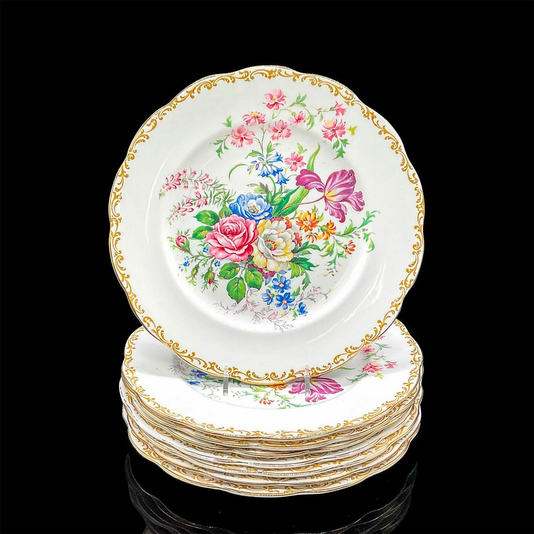 8pc Royal Albert Bone China Dinner Plates, Nosegay: Eight plates in a lively colorful floral motif with gold rims and accents. Royal Albert backstamp. 0.75"H x 10.25" dia. Manufacturer: Royal Albert Country of Origin: England