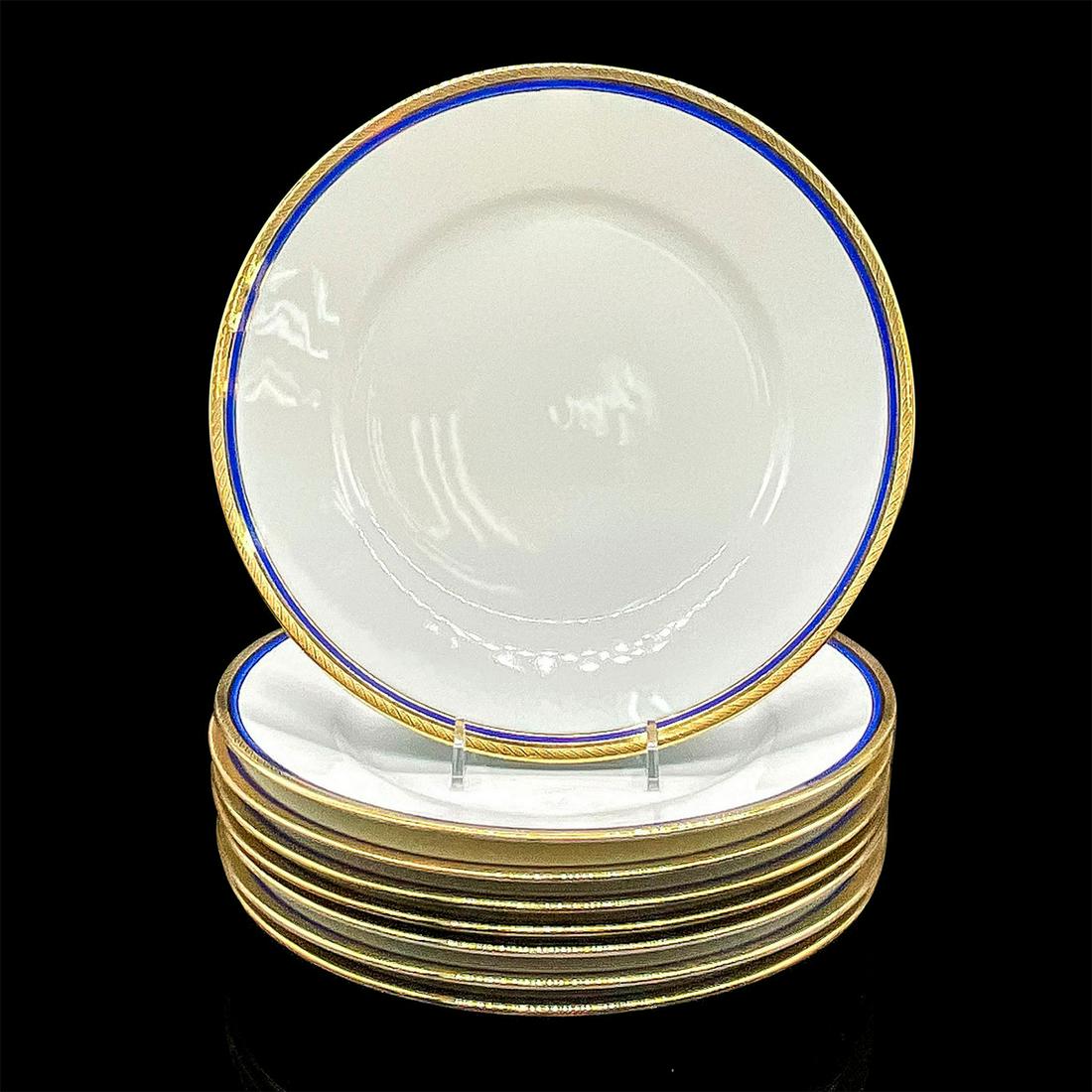 8pc Richard Ginori Porcelain Dinner Plates: Eight white plates with elegant cobalt blue ring and gold scroll design on the rim. Richard Ginori backstamp. Dimensions: 1"H x 9.75" dia Manufacturer: Pittoria Richard Ginori Country of Origin: Italy