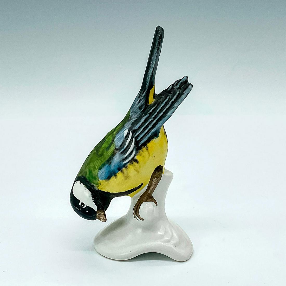 Goebel Bird Figurine, Great Titmouse: Depicts adorable colorful little bird looking downward from its perch. Goebel sticker and backstamp. Issued: 1972 -1979 Dimensions: 1.75"L x 1.5"W x 3.5"H Manufacturer: Goebel Country of Origin: Germa