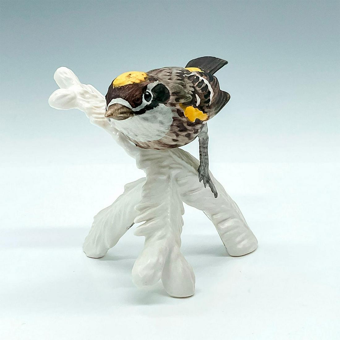 Goebel Bird Figurine, Yellow-rumped Warbler: Handpainted bird with brown, grey, and yellow patterning standing ontop of a white branch. Goebel backstamp and sticker. Issued: 1972-1979 Dimensions: 5"L x 3.75"W x 3.75"H Manufacturer: Goebel Countr