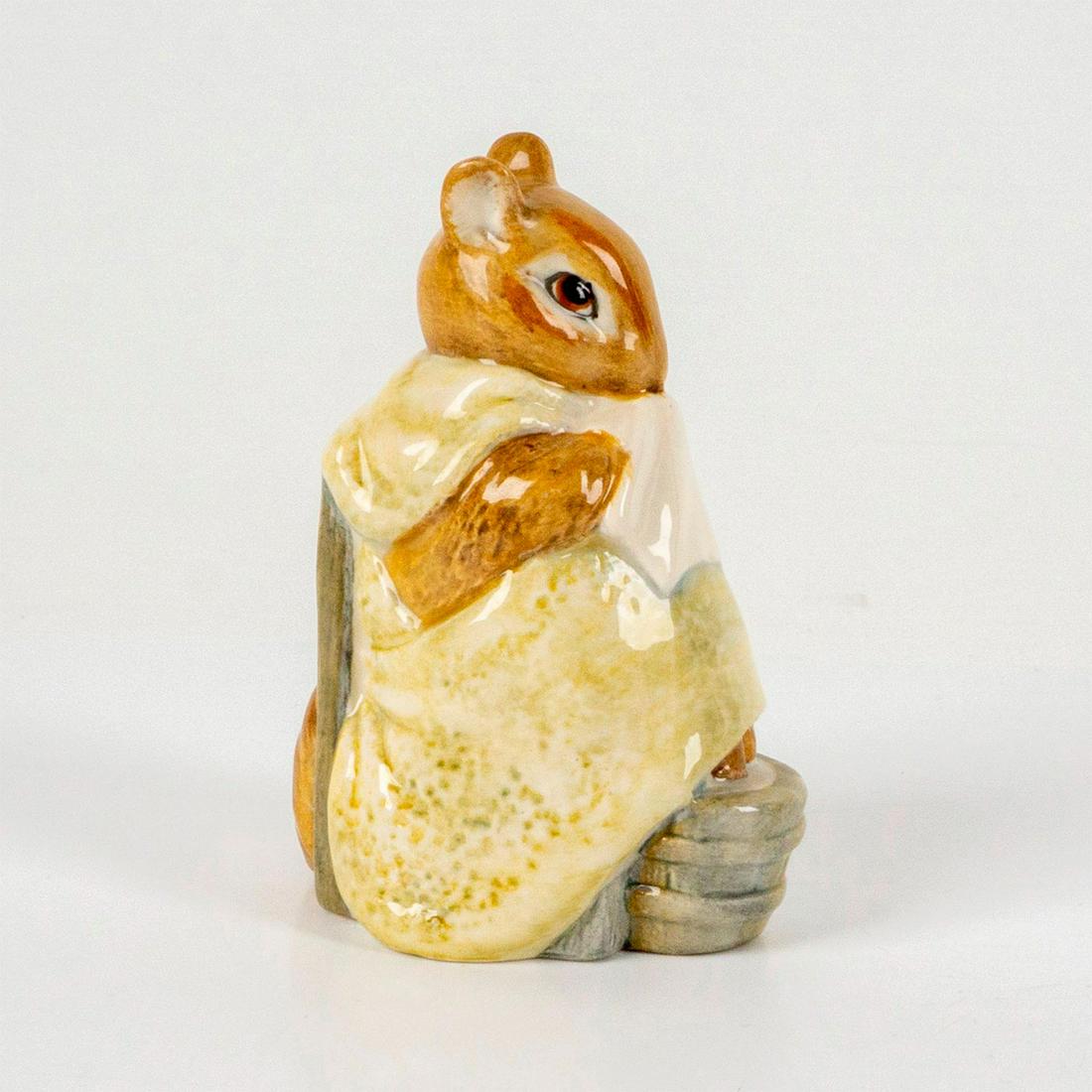 Beswick Beatrix Potter's Figurine, Chippy Hackee: Depicts a squirrel having a foot bath while holding a handkerchief and wrapped in a pale-yellow blanket. Beswick backstamp. Dimensions: 2.25"L x 1.75"W x 3.5"H Manufacturer: Beatrix Potter Country of