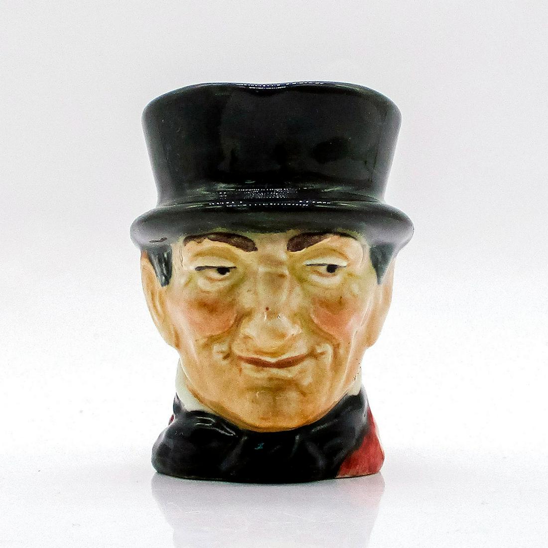 John Peel D6130 - Mini - Royal Doulton Character Jug: Variation One, grey handle. Dark grey hat; maroon coat; dark blue bow tie; grey riding crop. John Peel (1776 - 1854) was a famous English huntsman, known for his enthusiasm, skill, and hospitality. Fo