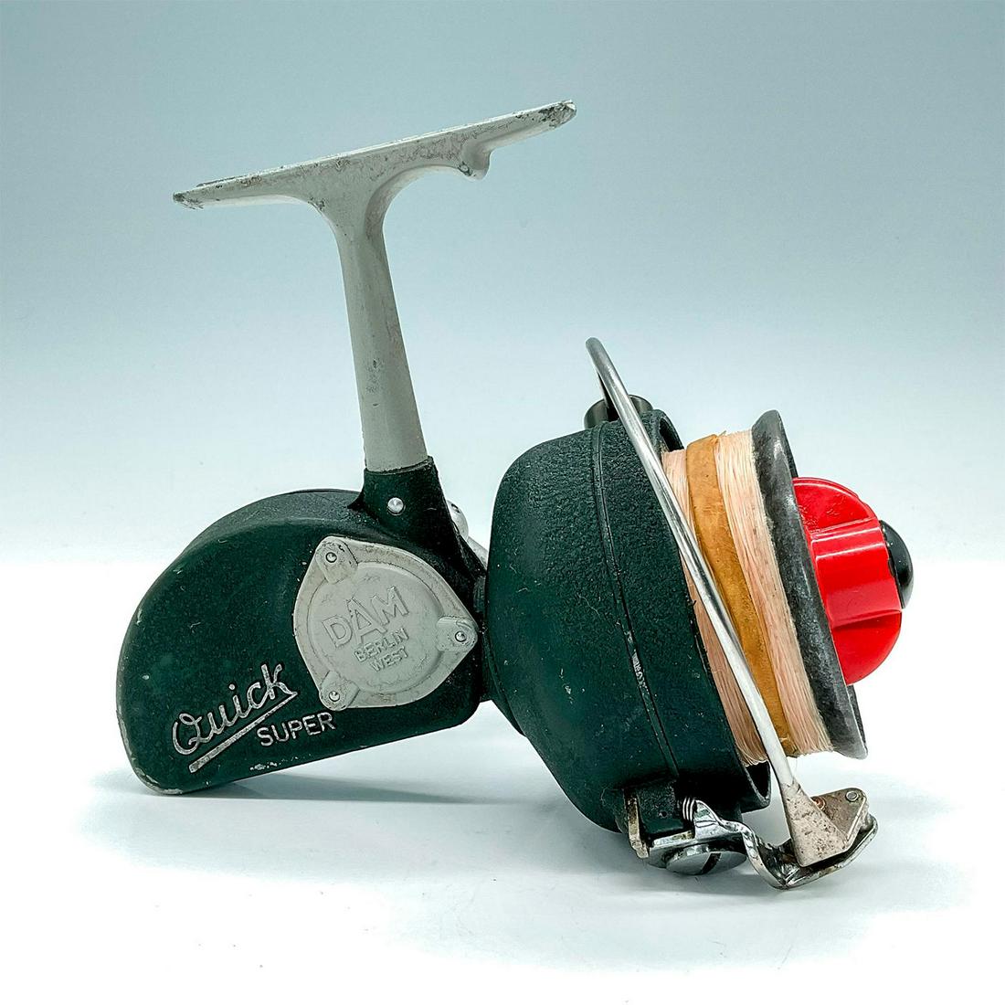 Vintage D.A.M. Quick Super Spinning Reel: Brawny sized German import, spinning reel. Made from aircraft grade aluminum bodies. All components are very strong and overbuilt for performance and longevity. Dark green body with raised letters rea