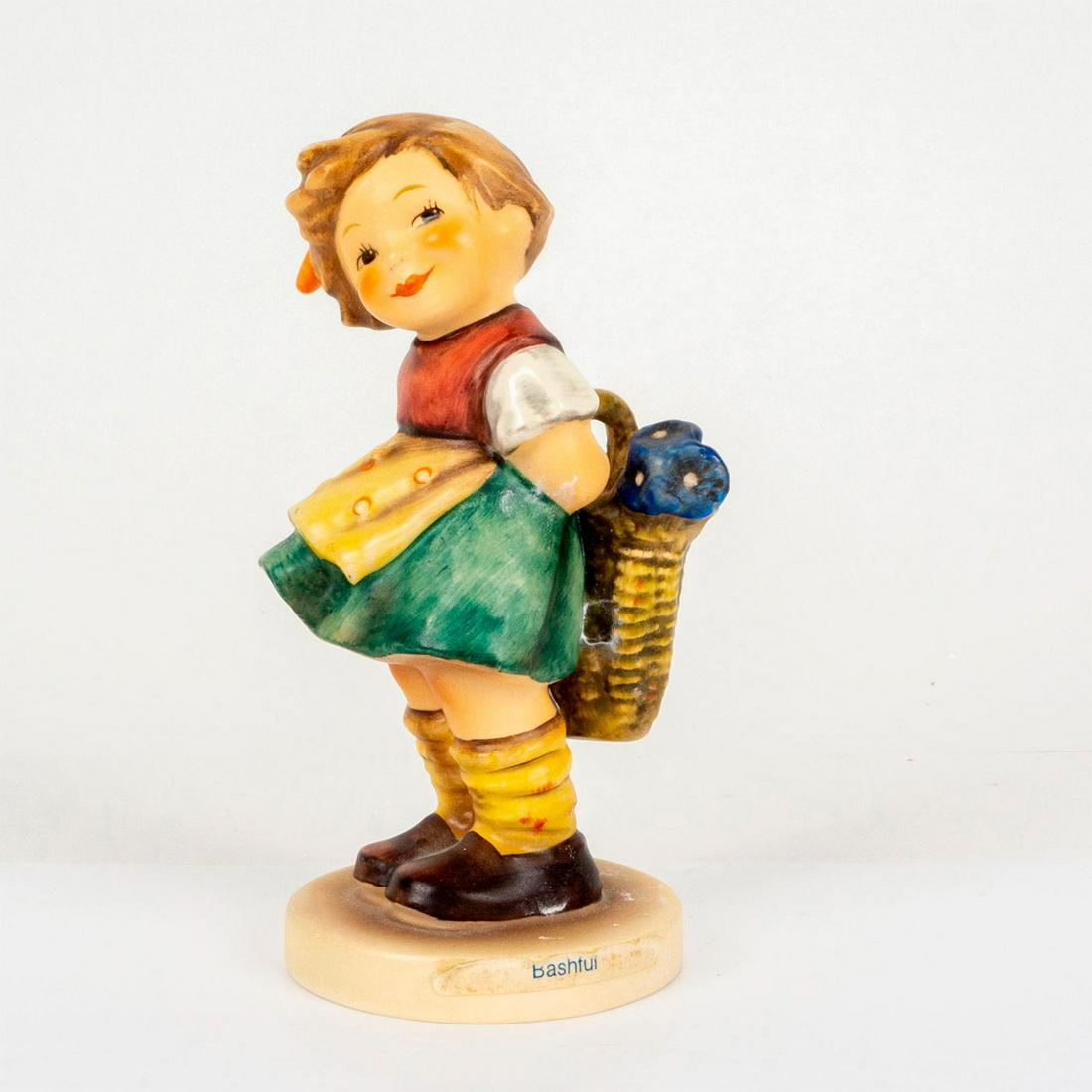 Goebel Hummel Figurine, Bashful: Porcelain hand painted in matte finish. Goebel backstamp. Impressed M. I. Hummel to base. Dimensions: 2.5"W x 5.25"H Manufacturer: Goebel Hummel Country of Origin: Germany