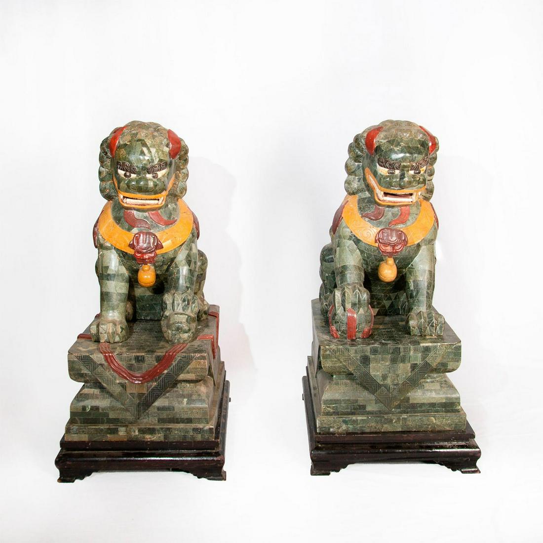 Pair of Chinese Fu Dogs Statues with Bases: 2 impressive palatial male and female foo dogs, crafted to imitate green marble. Includes 2 original green resin bases and 2 black lacquer bases. Foo dog: 22”L x 15”W x 28.5”H. Green