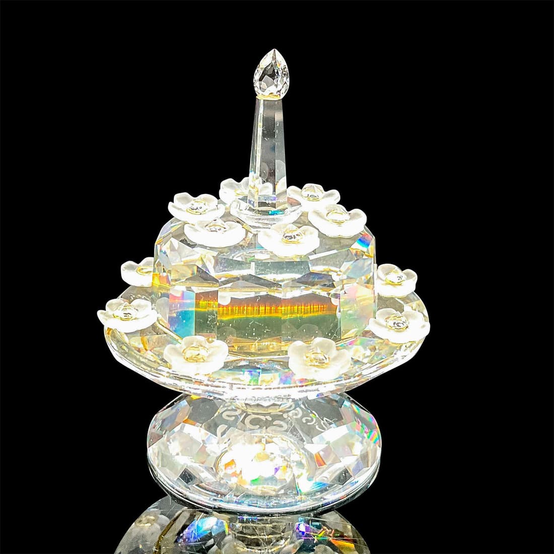 Swarovski Crystal Figurine, Birthday Cake 169678: Limited edition SCS birthday cake made to commemorate the 5th anniversary of the SCS. Clear crystal cake on a stand decorated with frosted crystal flowers. Swarovski etched backstamp. This item has it