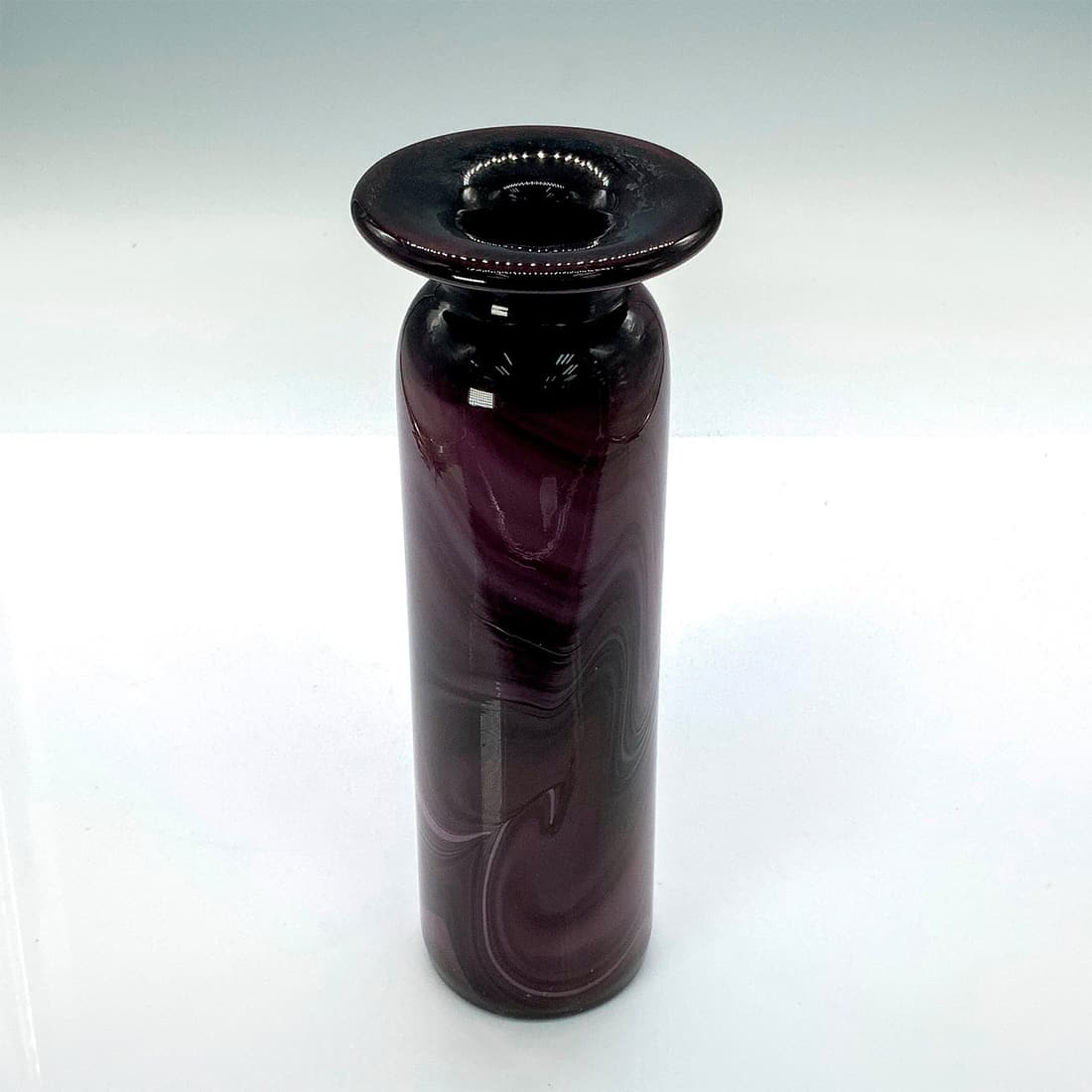 Unique Marbled Purple Blown Glass Vase: Deep purple vase with illegible signature on bottom. Dimensions: 2.5"dia. x 8.25"H