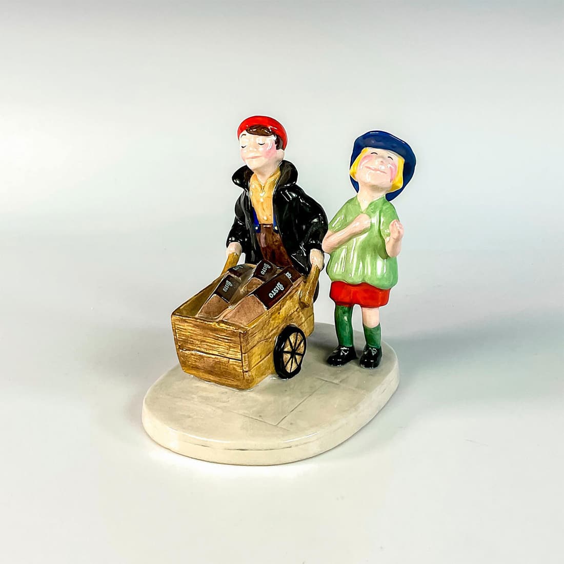 The Bisto Kids MCL4 - Royal Doulton Advertising Figurine: Limited edition adware figurine modeled as two smiling boys with cart full of Bisto gravy boxes. Produced by Millennium Collectables LTD for Centura Foods LTD. Royal Doulton backstamp. Issued: 2002 Di
