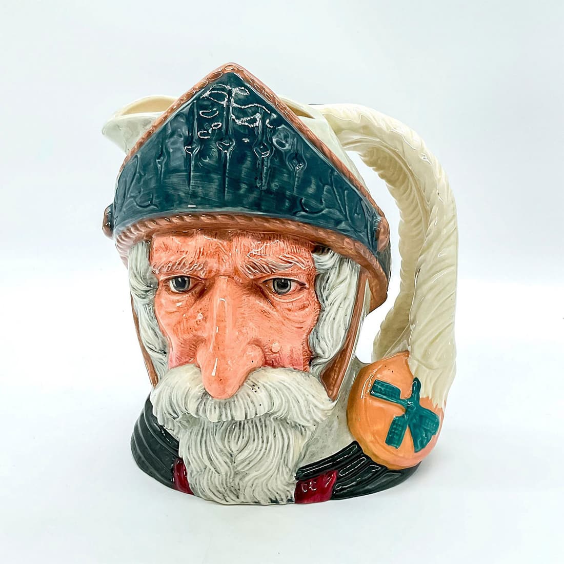 Don Quixote D6455 - Large - Royal Doulton Character Jug: Blue-grey helmet, dark green robes. Don Quixote is the hero of the novel by Cervantes, a satirical parody of this chivalrous knight. Don Quixote leads a life of adventure, capturing many hearts along 