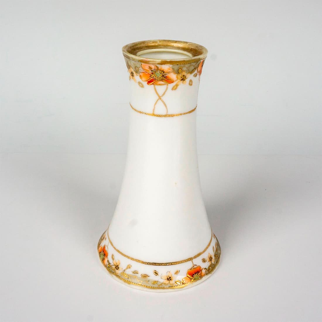 Nippon Porcelain Hatpin Holder: A hand painted vessel with heavy floral gilt decoration. Nippon backstamp. Dimensions: 2.75"W x 4.75"H Manufacturer: Nippon Country of Origin: Japan