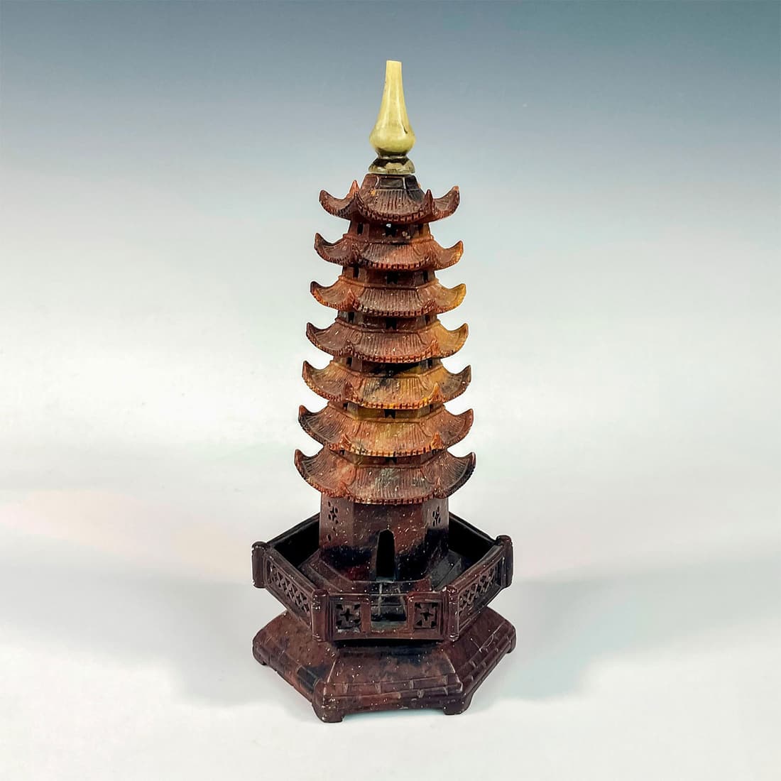 Carved Model Soapstone Pagoda: Asian seven-tiered design. Jade colored spire with body in marbled brown. No markings or backstamp. Dimensions: 4"L x 4"W x 9.5"H