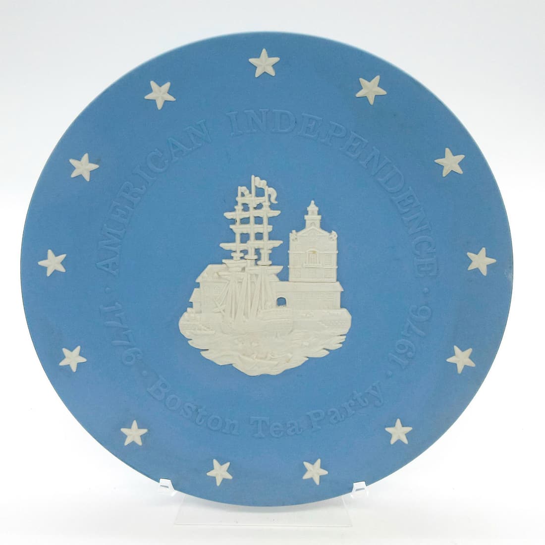 Vintage Wedgwood Blue Jasperware Plate, Boston Tea Party: American Independence, 1776-1976. 200th Anniversary. Decorated with image depicting the landmark event and stars around rim in high relief. Wedgwood impressed backstamp. Dimensions: 8" Diameter Manufa