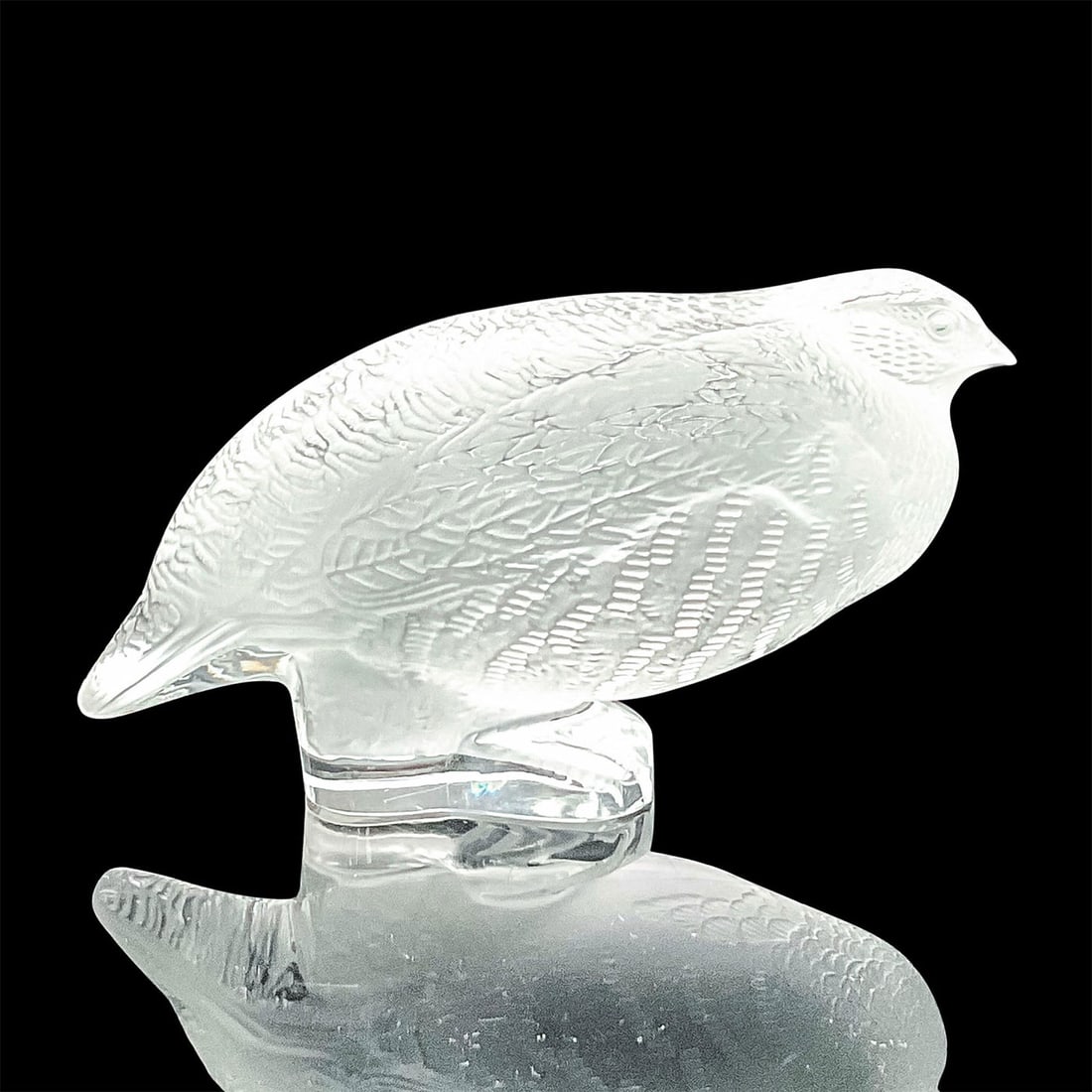 Lalique Crystal Perdrix Figurine: A frosted figure of a Grey partridge bird with clear accents on the feathers. Signed Lalique France in script. Dimensions: 6.25"L x 3.25"W x 3.25"H Manufacturer: Lalique Country of Origin: France
