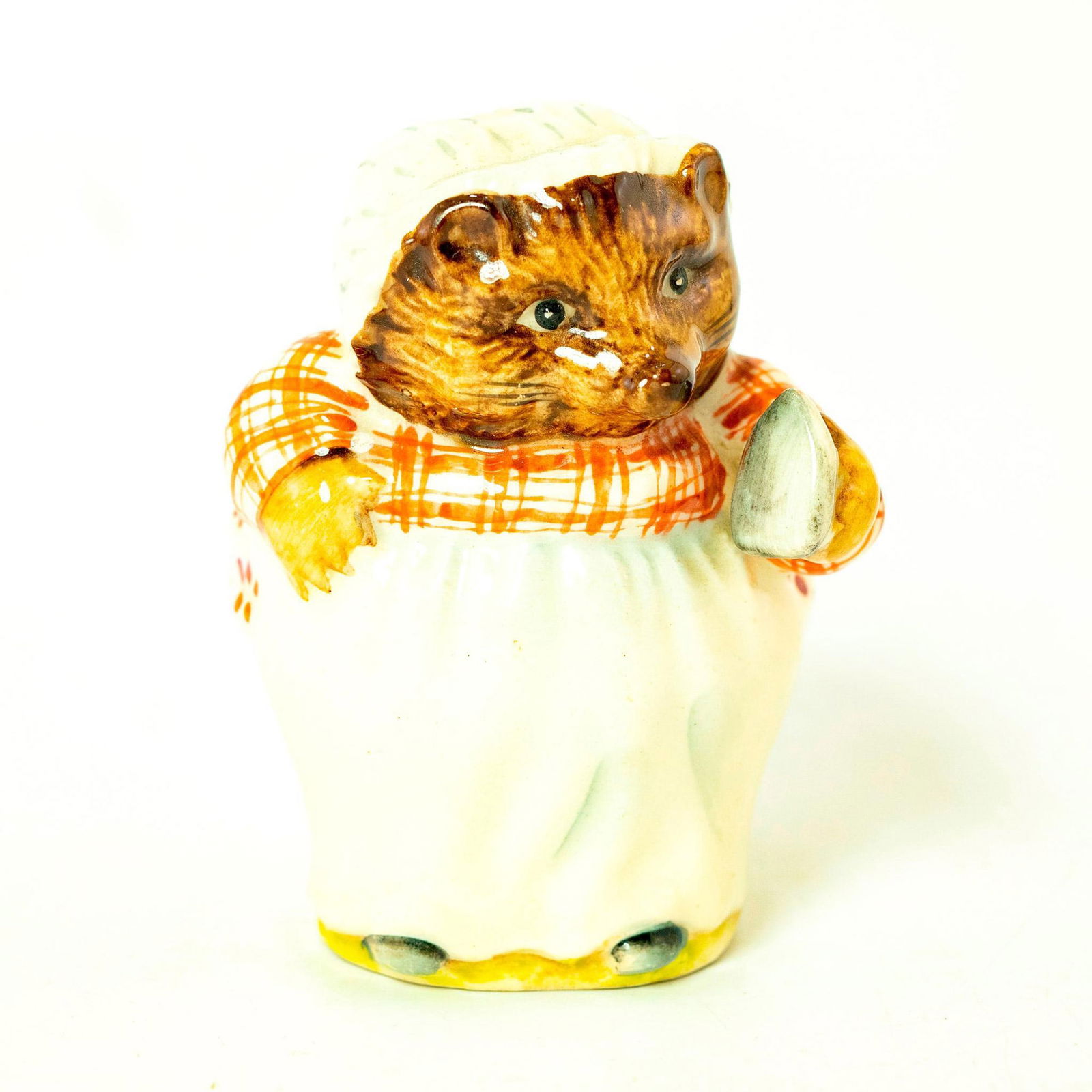 Mrs. Tiggy Winkle - Beswick - Beatrix Potter Figurine: Beswick Backstamp. Plaid striped red- brown and white dress, green and blue striped skirt, white apron. Artist: Arthur Gredington Issued: 1970-2000 Dimensions: 3.25''H Manufacturer: Beswick Country of