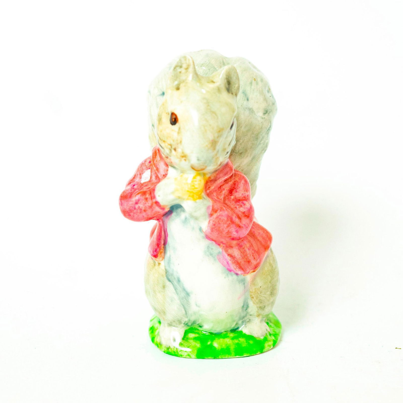 Timmy Tiptoes (Grey) - Beswick Gold/Brown - Beswick - Beatrix Potter Figurine: Beswick Backstamp. Grey squirrel, pink jacket. Artist: Arthur Gredington Issued: 1970 - c. 1977 Dimensions: 3.75''H Manufacturer: Beswick Country of Origin: England