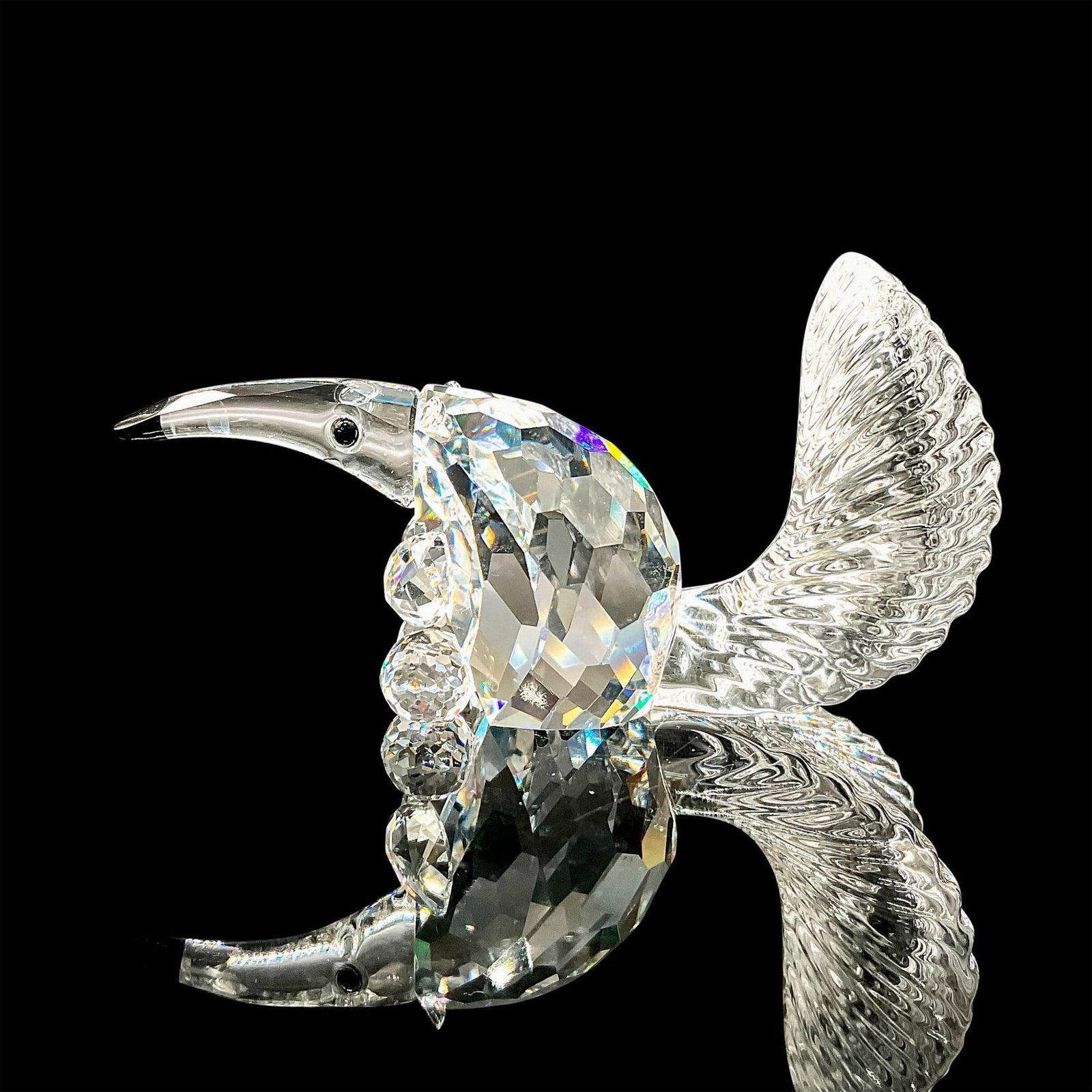 Anteater - Swarovski Crystal Figurine: Anteater is made in clear crystal, its body is faceted, and the tail is molded, was designed for the Endangered Species theme group. This item has its original box 3.5"H x 2.25dia. Certificate of Auth