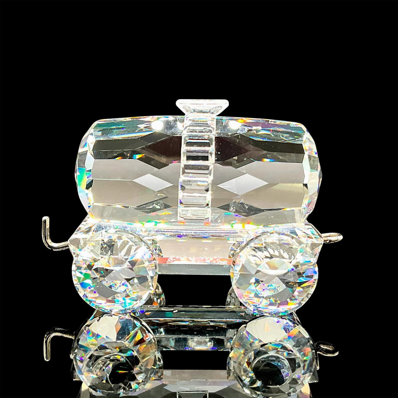 Tank Wagon - Swarovski Silver Crystal Figurine: Part of When We Were Young group. Clear barrel body with silver hook and latch. Swarovski backstamp. 7471 000 006. This item has its original box: 3"L x 3"W x 2.25"H. Certificate of Authenticity inclu