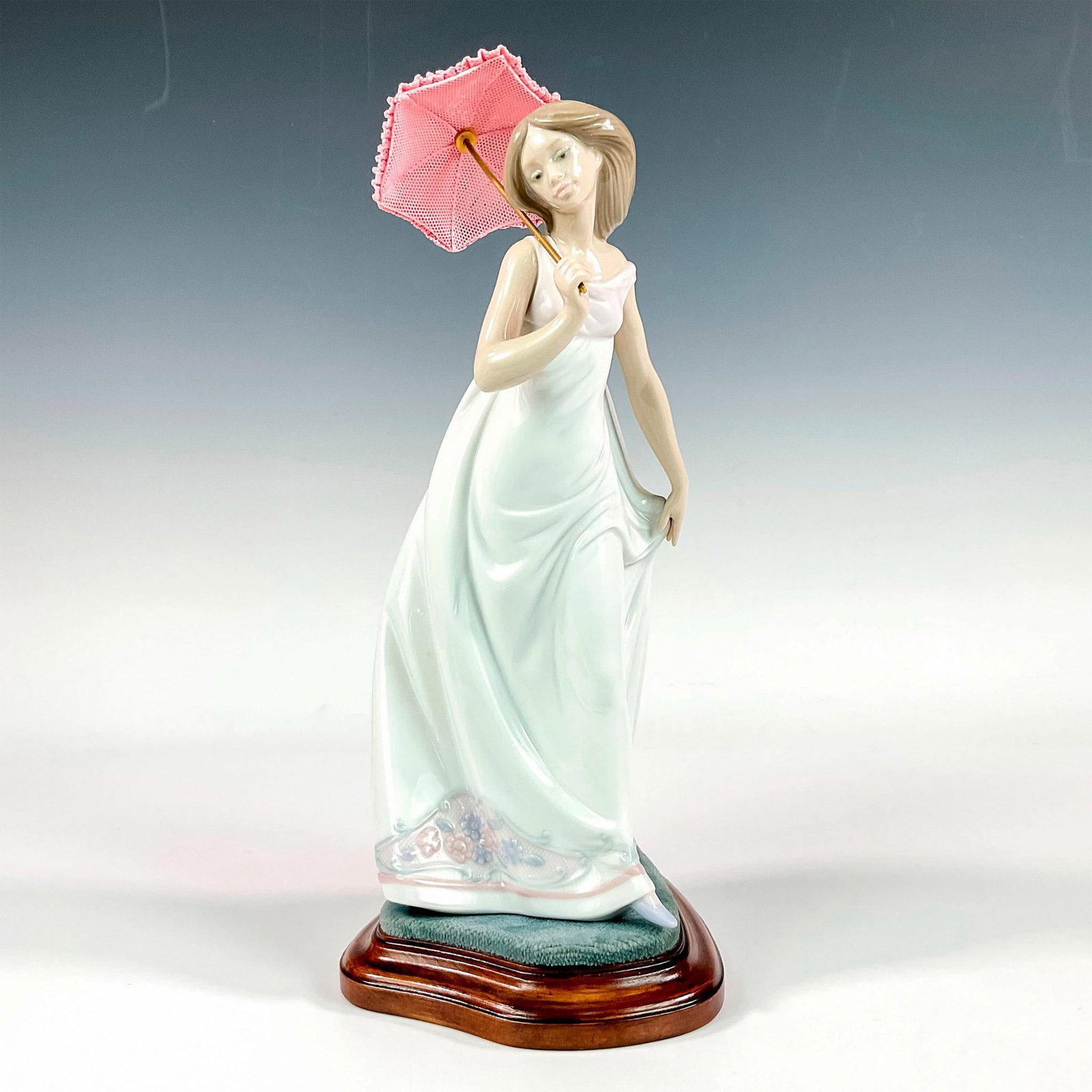 Afternoon Promenade 1007636 - Lladro Porcelain Figurine: Glossy finish; Lladro backstamp. Includes original box. Box measures: 7.5"L x 12.5"W x 6"H. Includes base. Base measures: 4.5"L x 5.75"W x 1.25"H. Artist: Jose Puche Issued: 1995 - 1995 Dimensions: 11