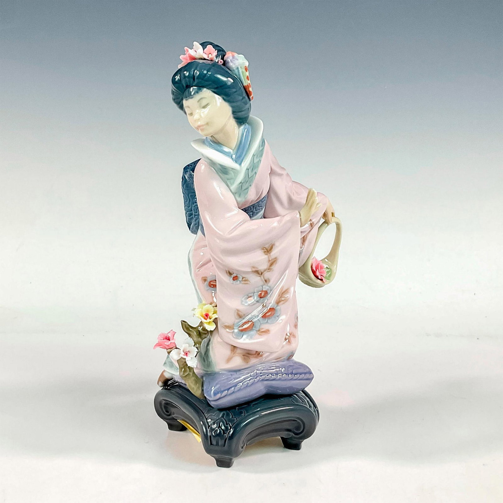 Michiko 1001447 - Lladro Porcelain Figurine: Glossy finish; Lladro backstamp. Artist: Salvador Debon Issued: 1983 - 2007 Dimensions: 8.75"H x 5.5"W Manufacturer: Lladro Country of Origin: Spain