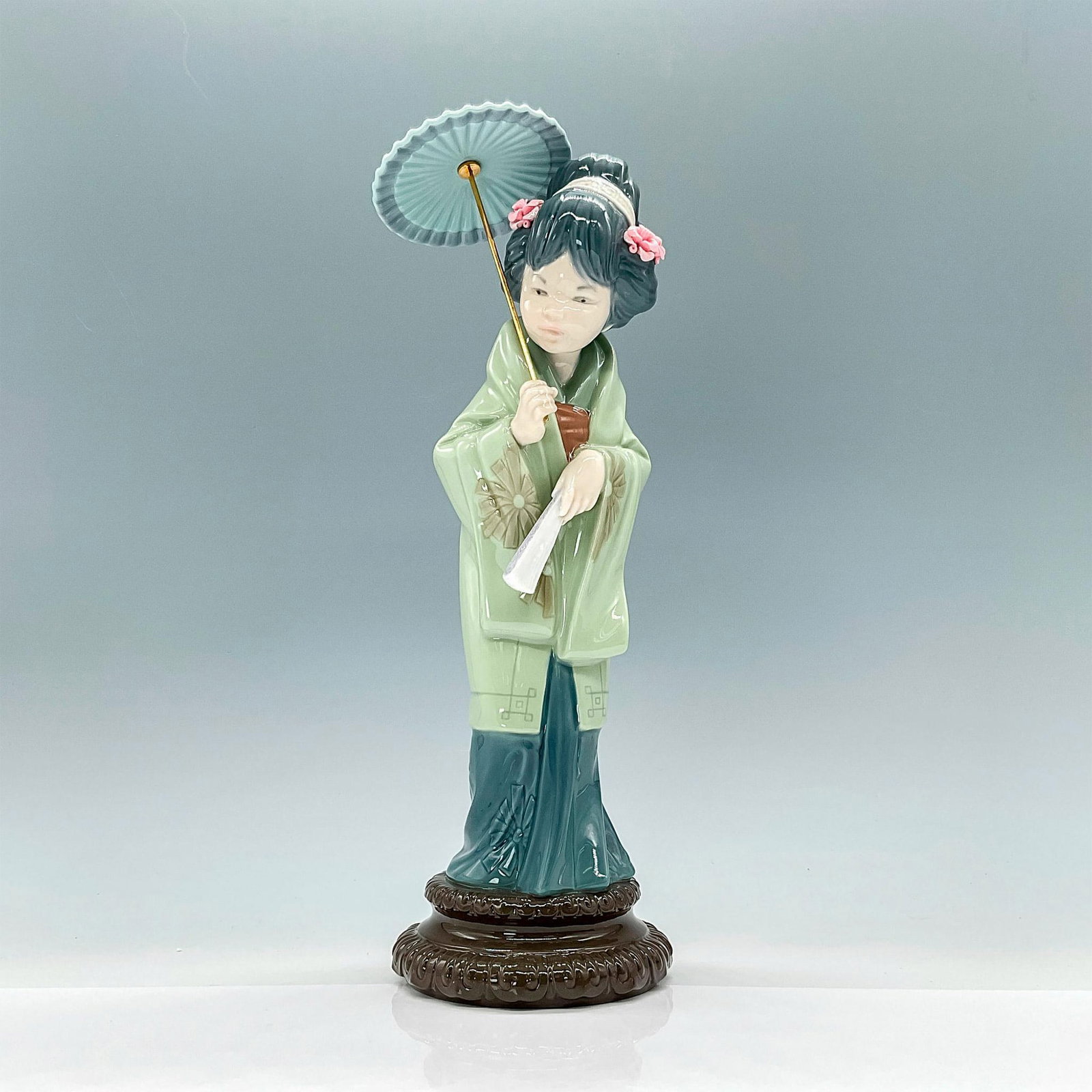 Oriental Spring 1004988 - Lladro Porcelain Figurine: Glossy finish; Lladro backstamp. Artist: Salvador Debon Issued: 1978 - 1996 Dimensions: 11.5"H Manufacturer: Lladro Country of Origin: Spain