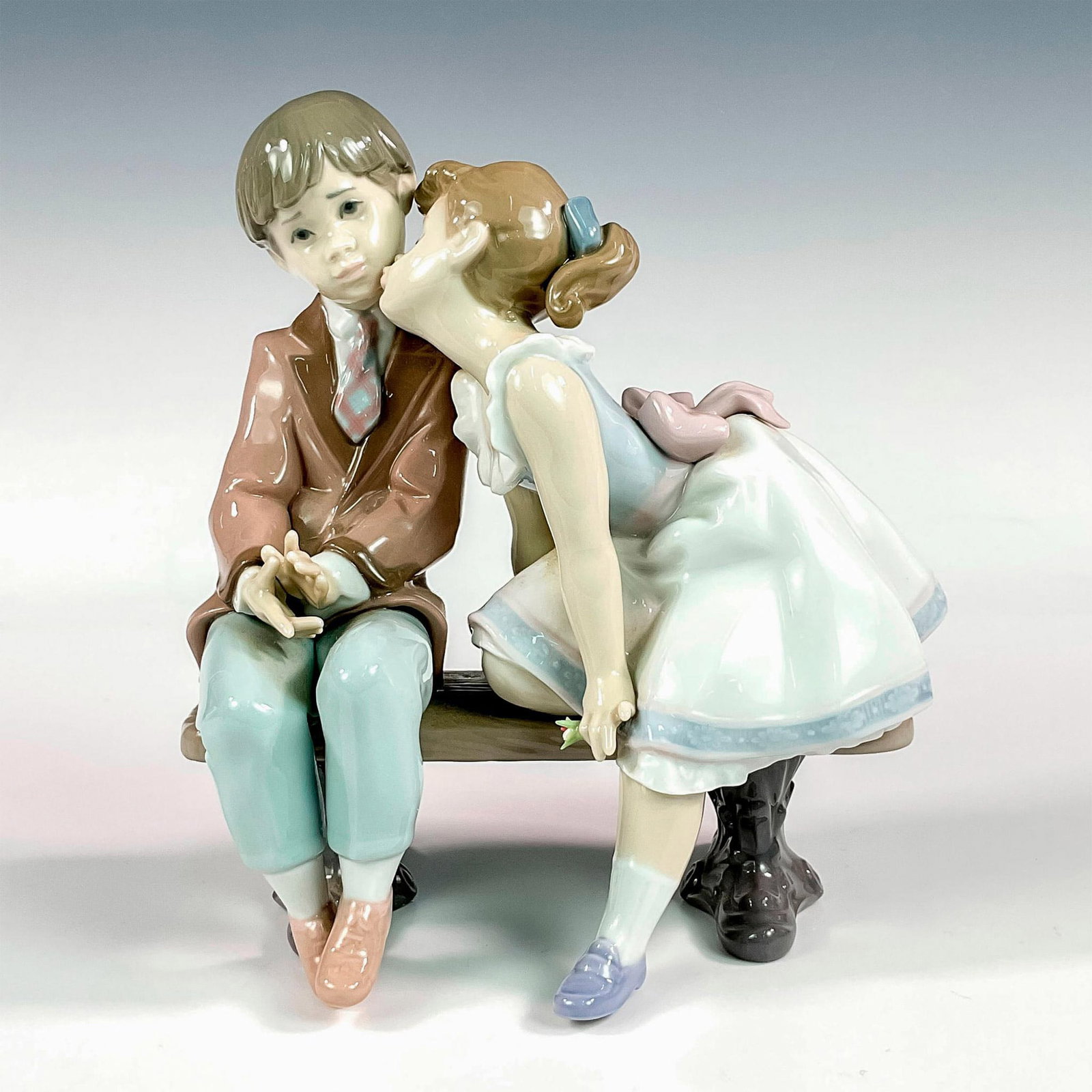 Ten & Growing 1007635 - Lladro Porcelain Figurine: Glossy finish; Lladro backstamp. Includes original box. Box measures: 9.25"L x 10.25"W x 8"H. Artist: Francisco Polope Issued: 1995 - 1995 Dimensions: 7.75"H x 7"W Manufacturer: Lladro Country of Orig